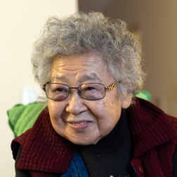 Citymeals on Wheels recipient Shin Ho, an older Korean woman with glasses and grey hair. 