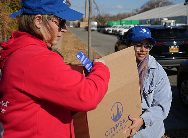 Resorts World volunteers with Citymeals' Emergency Food Package (EFP)