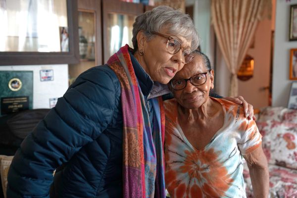 Rebecca delivers fresh groceries to meal recipient Grace. 